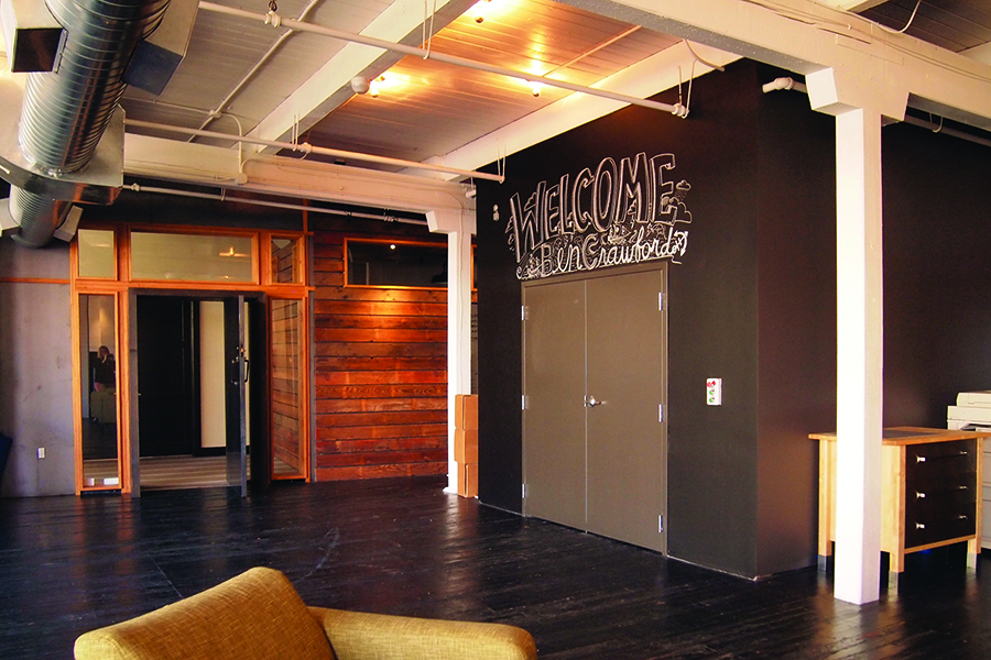 Interior event space with hand-drawn style welcome mural