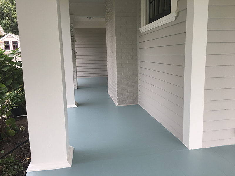 Freshly painted porch with pewter siding and blue floor